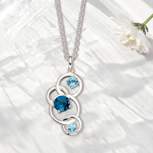 Hampers and Gifts to the UK - Send the  Sterling Silver Blue Topaz Circle Necklace 